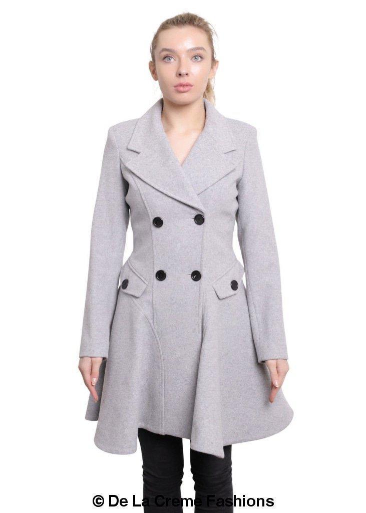 Woman modeling a Wool Blend Double Breasted Skater Coat from De La Creme Fashions, featuring a stylish grey color and two side pockets.