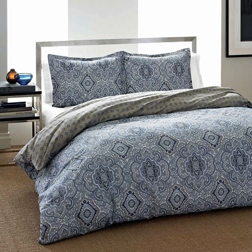 Elegant blue and gray paisley pattern bedding set in a modern bedroom setting