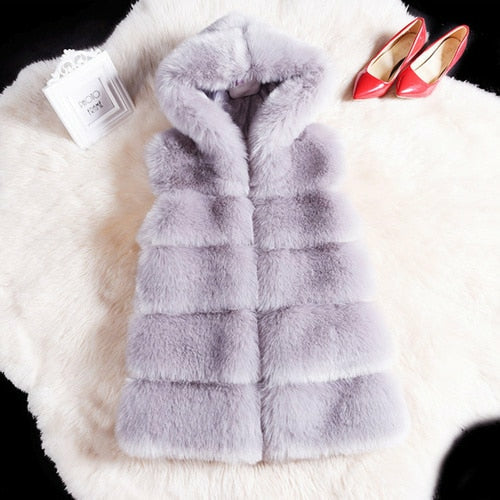 2022 Winter sleeveless artificial fox fur coat gilet in lavender displayed with red heels, highlighting luxe faux fur texture and hooded design.