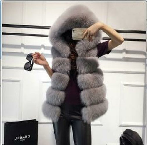 Woman wearing 2022 Winter Sleeveless Artificial Fox Fur Coat Gilet taking a selfie with hidden face, stylish faux fur jacket