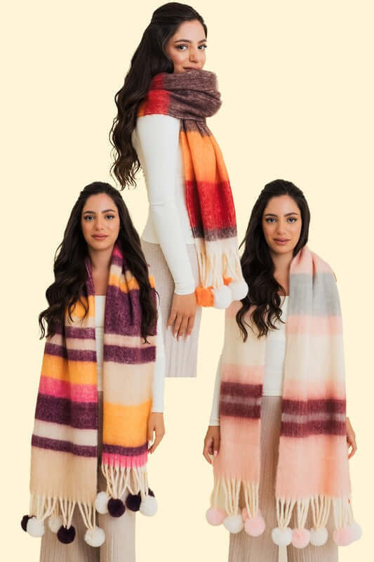 Contrast color stripes chunky pom tassel scarf featuring bold hues, cozy design, and playful pom tassels on model.