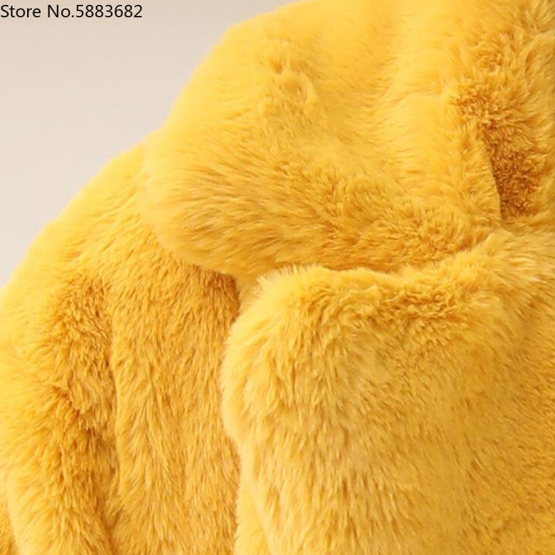 Close-up of a yellow 2022 Autumn Winter New Women Faux Fur Coat with fluffy thick texture and elegant design.