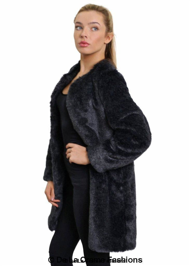 Woman modeling De La Creme Women's Grey Faux Fur Classic Coat, standing side profile with elegant look.