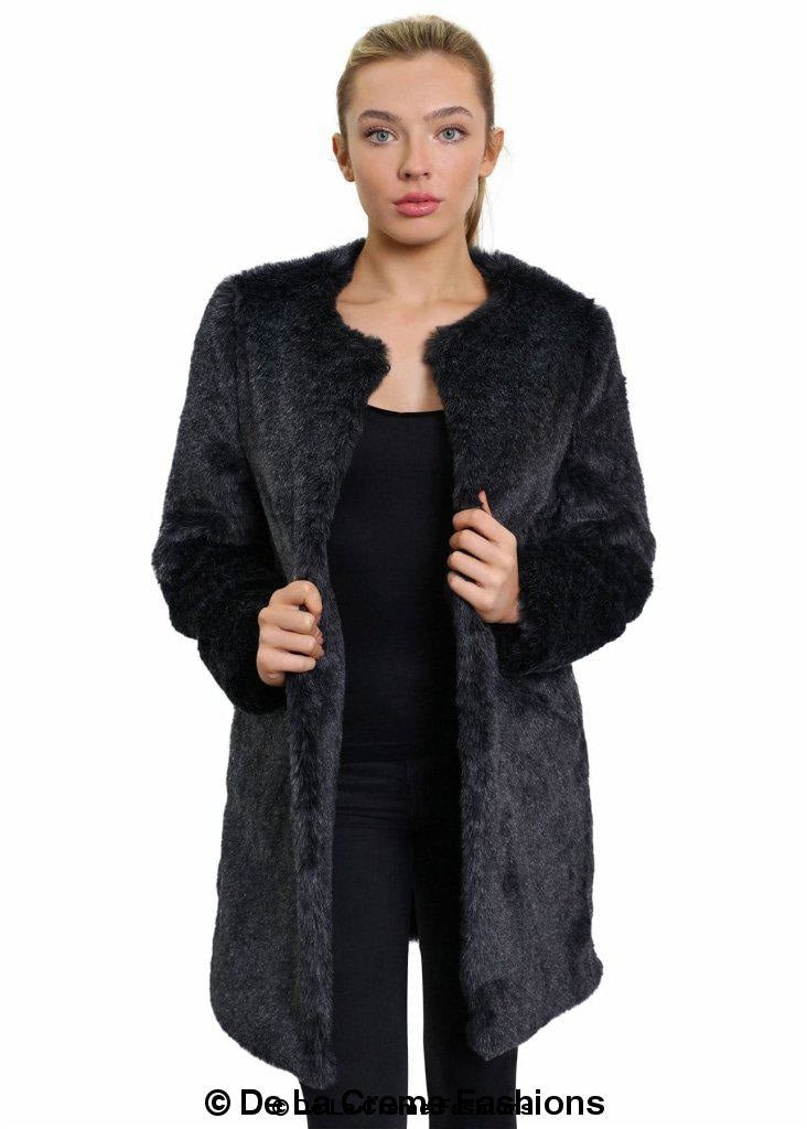 Woman modeling a De La Creme Women's Grey Faux Fur Classic Coat, standing with hands slightly open.