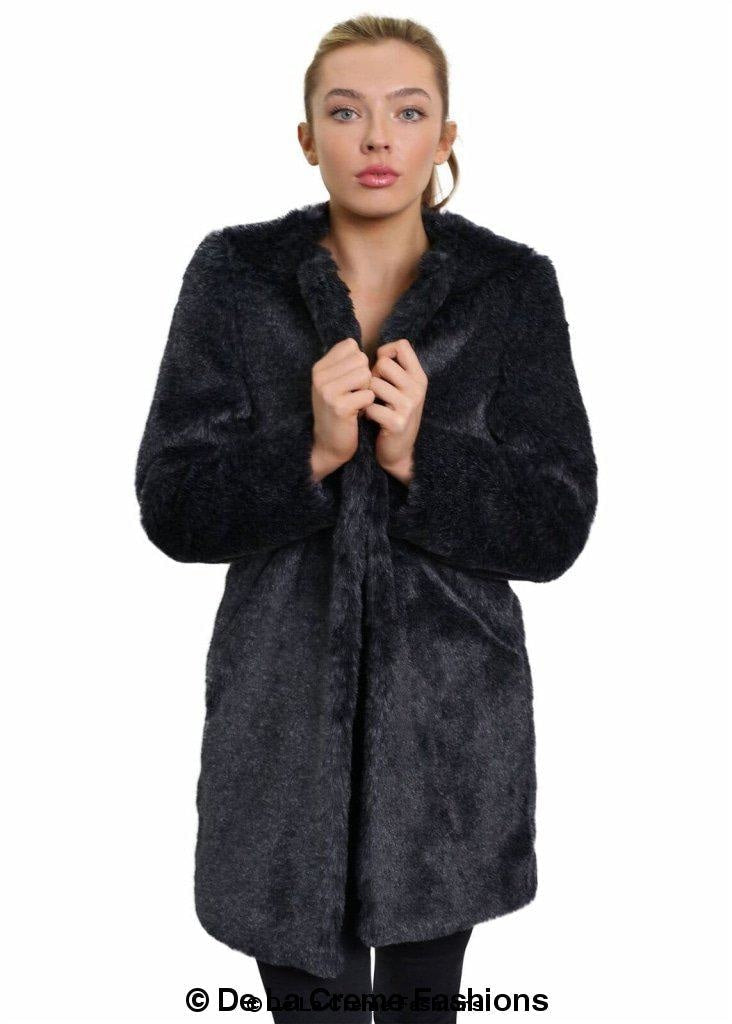 Woman modeling De La Creme Women's Faux Fur Classic Coat in grey, showing soft texture and elegant design.