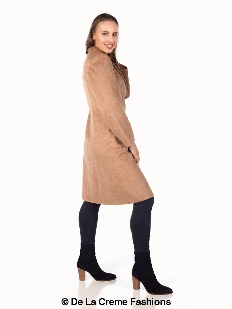 Woman modeling De La Creme Women's Mohair Blend Longline Winter Coat in camel, paired with black leggings and ankle boots.