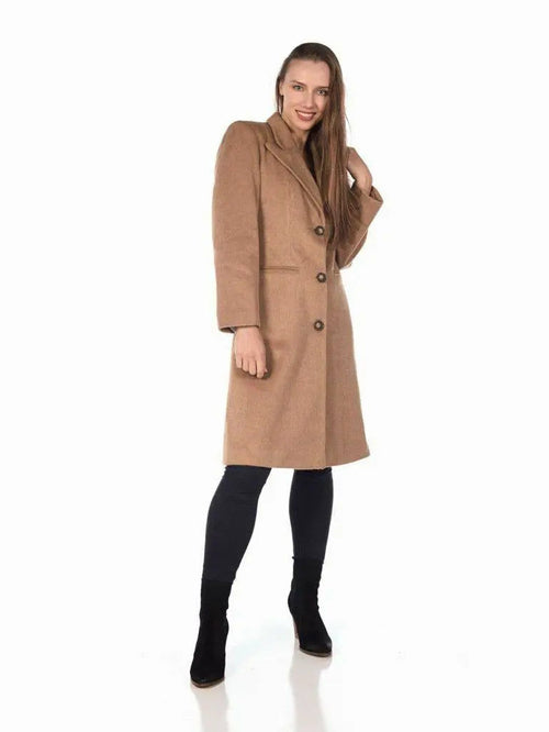 Woman modeling De La Creme Women's Mohair Blend Longline Winter Coat in beige, paired with black leggings and ankle boots.