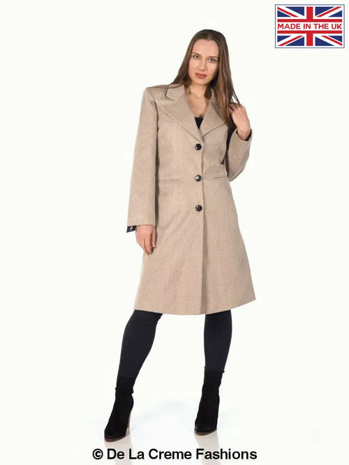 Woman modeling a De La Creme Women's Mohair Blend Longline Winter Coat in beige, standing with hand on hip.