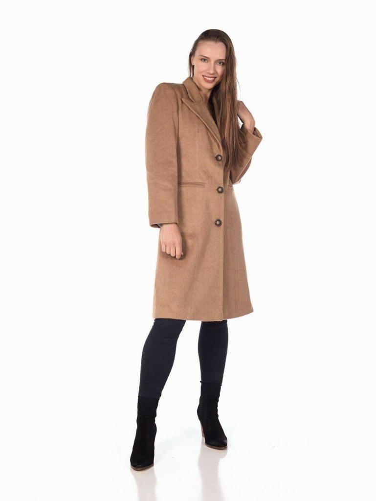 Woman modeling De La Creme Women's Mohair Blend Longline Winter Coat in tan color with black leggings and boots