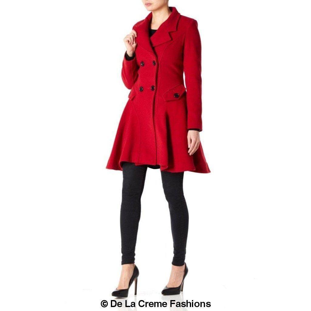 Woman modeling a red Wool Blend Double Breasted Skater Coat (1102) by De La Creme Fashions, featuring elegant design and side pockets.