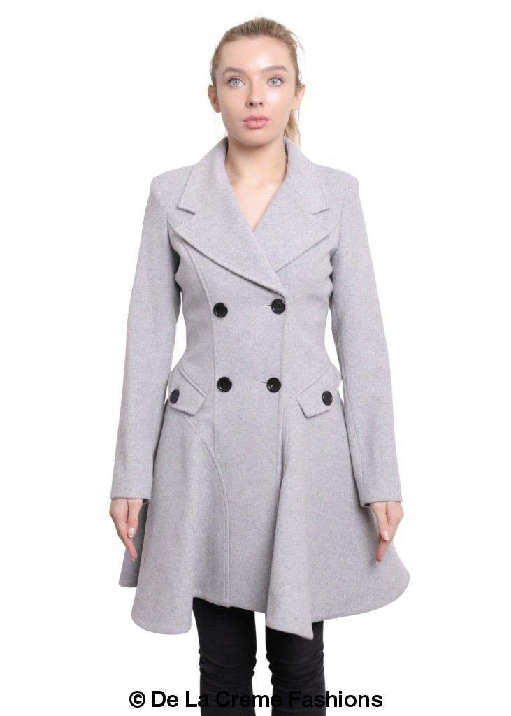 Woman modeling a Wool Blend Double Breasted Skater Coat from De La Creme Fashions, featuring a stylish grey color and two side pockets.