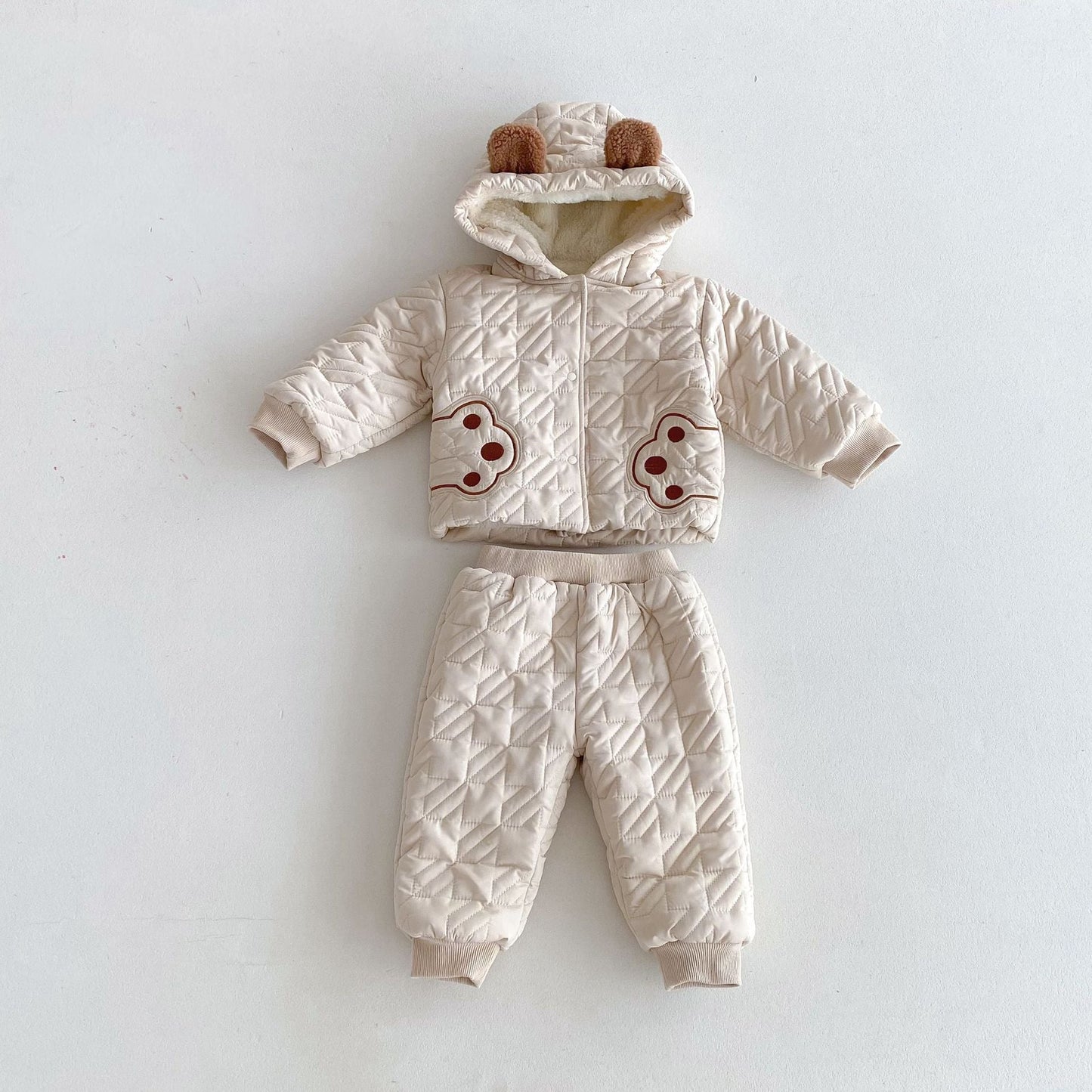 Infant winter outfit featuring a beige teddy paws patterned coat with hood and matching thick pants